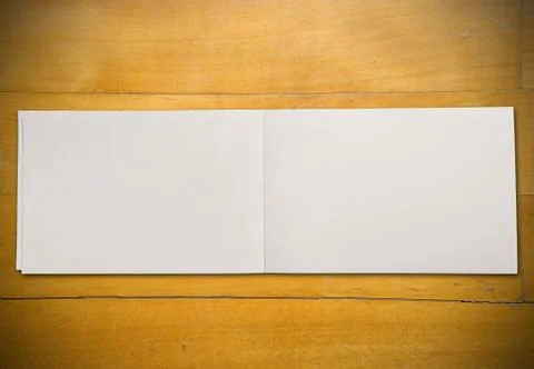 Open book on table Stock Photos