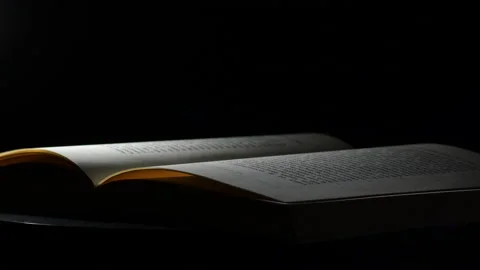 Open book turning with black background Stock Footage 149001518