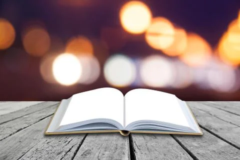 Open book with twilight background Stock Photos