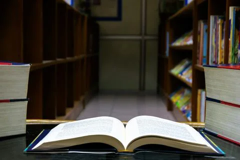The open book was placed on a table in the library Stock Photos