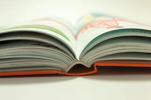 Open book on white background Stock Photos