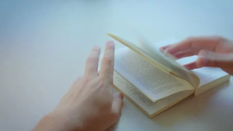 Open book on white windowsill, close up Stock Footage 198548275