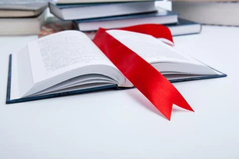 Open book whith red bookmark Foto stock