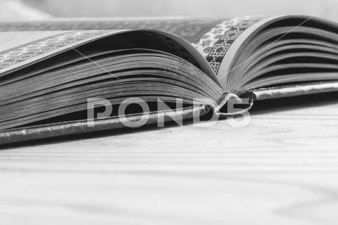 Open book on the wooden table with copy space, selective focus and shallow de Stock Photos