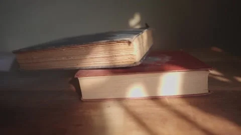 An open book on a wooden table Stock Footage 148101571