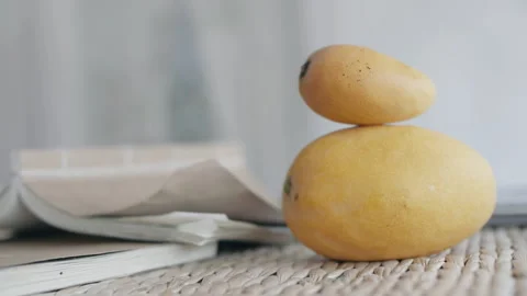 Open book, yellow mango, white room 스톡 동영상 186882054