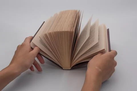 Open a book with your hands. close-up Stock Photos