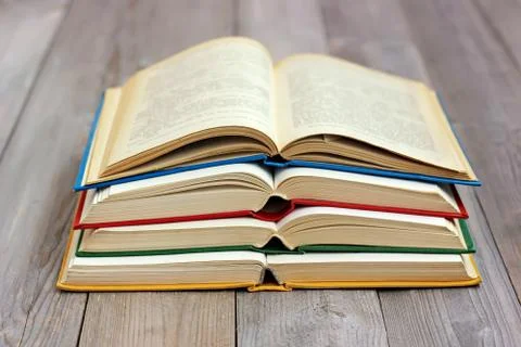 Open books on the table from boards. Stock-Fotos