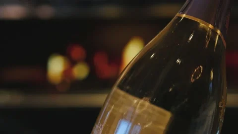 An open bottle of champagne on the background of an evening restaurant Stockbeeldmateriaal 223001159