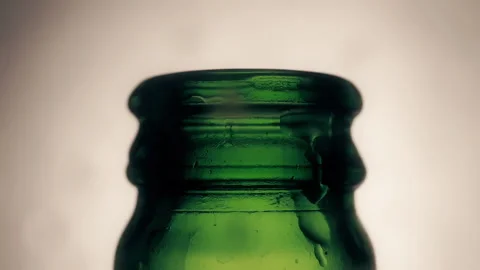 Open bottle of wet beer with drop motion in close-up Stock Footage 144666713