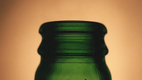 Open bottle of wet beer with drop motion in close-up Stock Footage 144666776