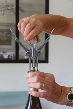 To open a bottle of wine Stock Photos