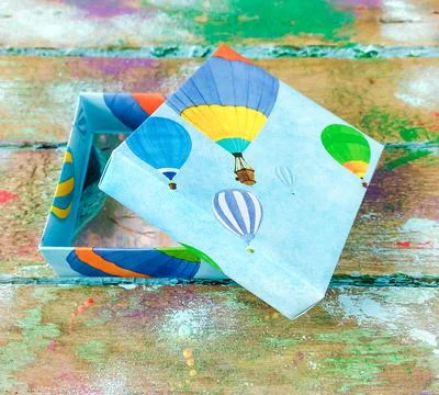 Open box with balloons Stock Photos