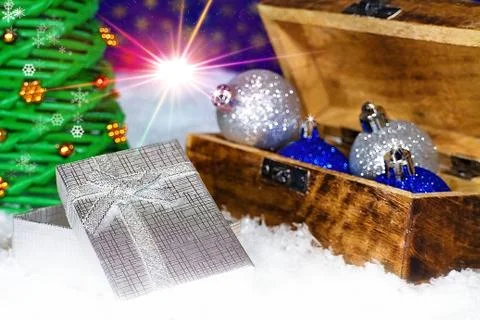 Open box with Christmas present under Christmas tree. Stock Photos