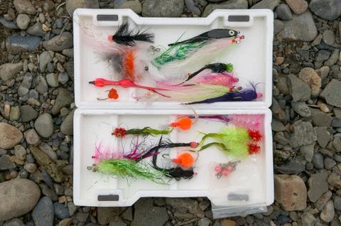 Open box with colorful array of salmon flies Stock Photos