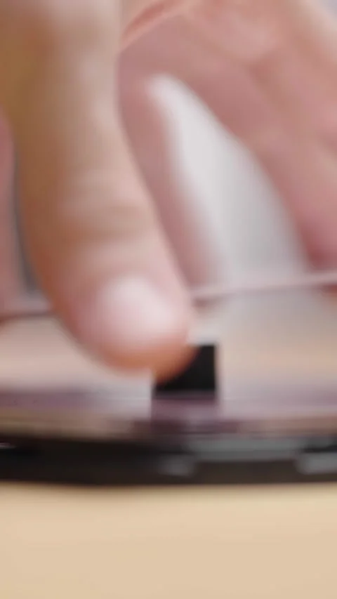 Open a box of DVD or CD media packaging with hands 库存影片 324967473