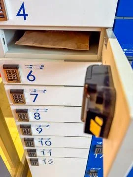 Open box with package in parcel locker 스톡 사진