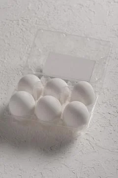 Open box with six whole white eggs  on white background with clipping path. F Stock Photos