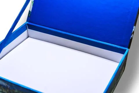 Open box with a white interior and a blue fabric cover on a white background Stock Photos