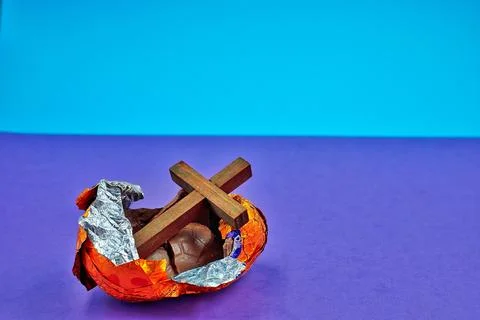 Open Broken Easter Egg on Purple And Blue Background Stock Photos