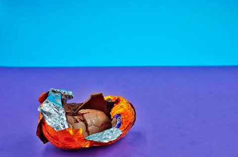 Open Broken Easter on Purple And Blue Background Stock Photos