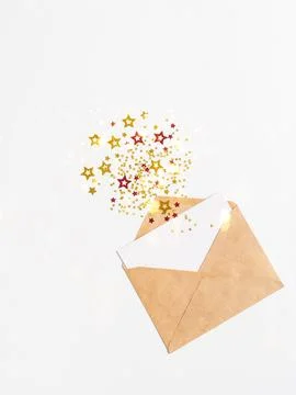 Open brown envelope with blank white card and various stars with imitation .. Stock Photos