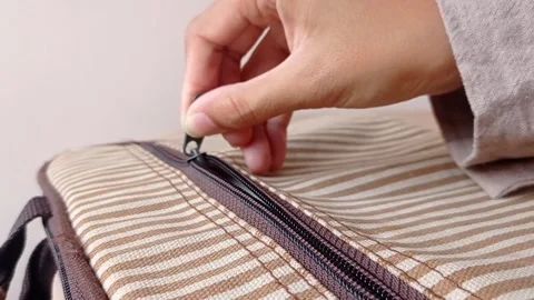 Open up a brown striped white bag Stock Footage 146246770