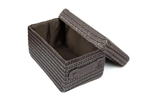 Open brown wicker box on white background Stock Photos
