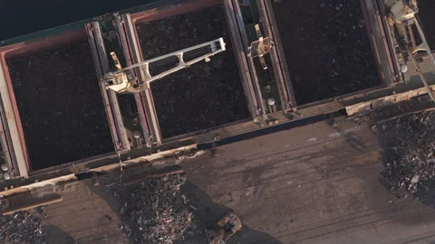 Open bulk cargo holds and excavators at Port of Veracruz quay, aerial Stock Footage 345184098