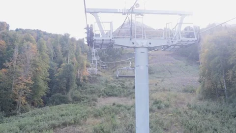 Open cable car. Climbing into the mountains, metal rack with mechanical rollers. Stock Footage 221301636