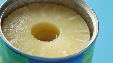 A open can of pineapple on table Stock Footage 161161381