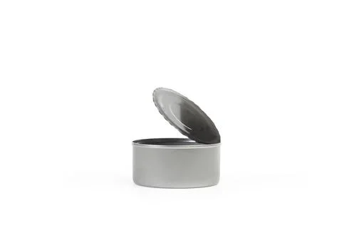 Open can of preserves on a white background with copy space Foto stock