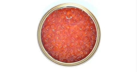 An Open Can With Red Caviar Rotates in a Circle, Close-up Shot of a Top View Stock Footage 122340324