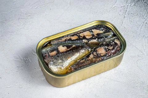Open can with sardine in olive oil. White background. Top view Stock Photos