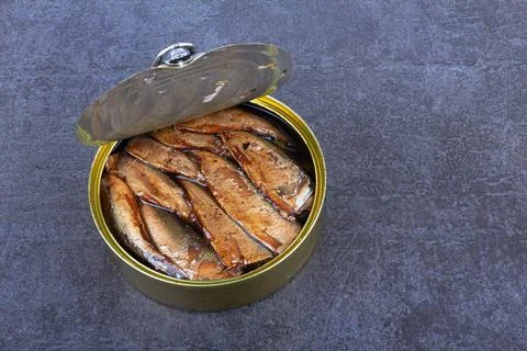 Open can with sprats Stock Photos