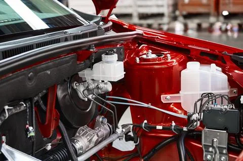 Open car engine section with vacuum assisted brakes Stock Photos