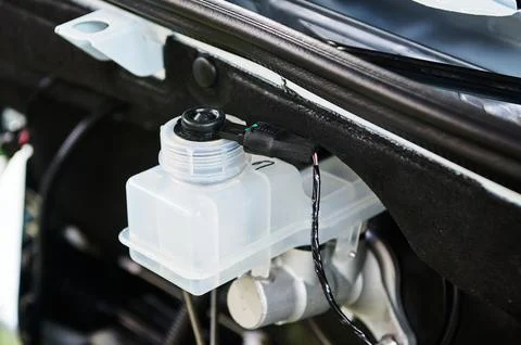 Open car engine section with vacuum assisted brakes Stock Photos