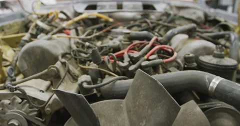 Open car engine standing in a township workshop being prepared to be repaired Video stock 132546851