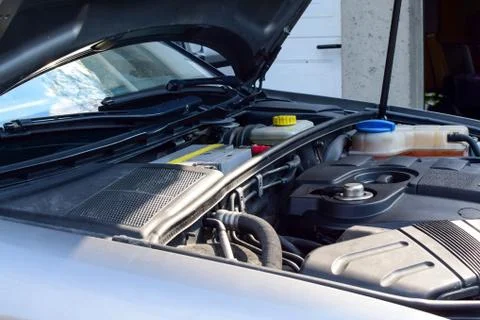Open car hood. Engine close-up. Stock Photos