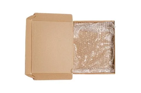 An open cardboard box with bubble wrap. The concept of packaging parcels wi.. Stock Photos