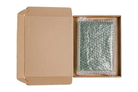 An open cardboard box with bubble wrap. The concept of packaging parcels wi.. Stock Photos