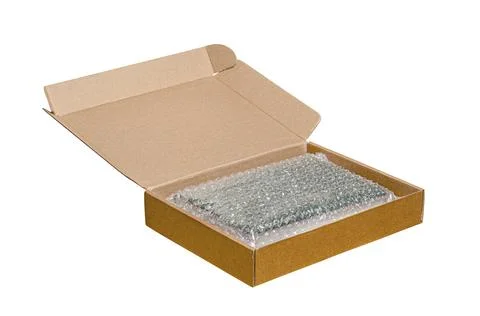 An open cardboard box with bubble wrap. The concept of packaging parcels wi.. Stock Photos