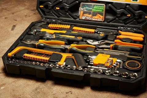 Open case with a set of locksmith tools. pliers, heads, bits, clamps, hacksaw Stock Photos