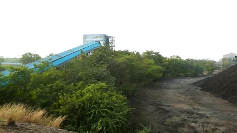 Open Cast Coal Mine with Excavator and Coal Stockpiles in Gujarat, India 05 Stock Footage 340947246