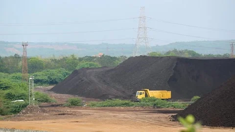 Open Cast Coal Mine with Excavator and Coal Stockpiles in Gujarat, India 02 Stock Footage 340947302