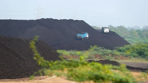Open Cast Coal Mine with Excavator and Coal Stockpiles in Gujarat, India 03 Stock Footage 340947406