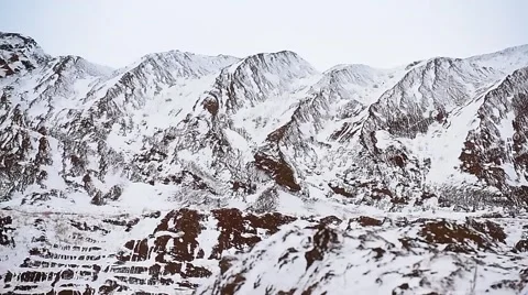 Open-cast. Snowy mountains. Pan. Stock Footage 63545348