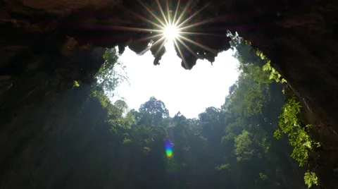 Open cave interior, looking up to gap in ceiling, waterfall sounds Video stock 50565169