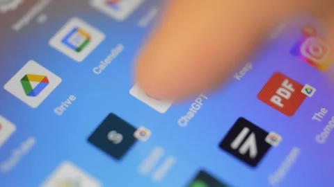 Open chatgpt artificial intelligence app on the phone display. Video stock 249828476