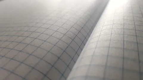 Open checkered notebook in blue and gray tones. Stock Footage 158971142